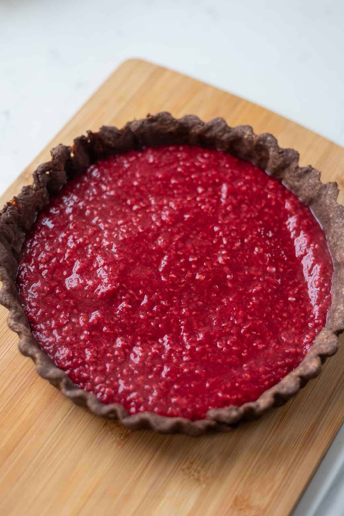Raspberry jam in a chocolate tart crust
